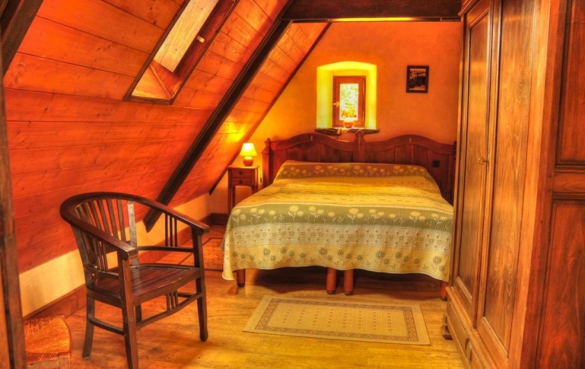 Location de vacances - Gîte à Clohars-Carnoët - La chambre de l'étage, un grand lit convertible en 2 lits simples
