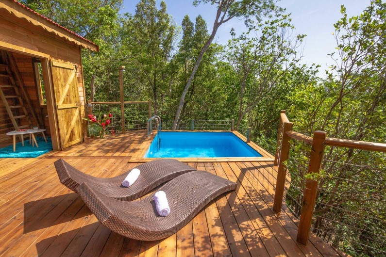 Location de vacances - Cabane dans les arbres à Deshaies - Cabane perchée avec piscine privée Jungle Lodge